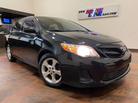 2013 Toyota Corolla for sale at Driveline LLC in Jacksonville FL