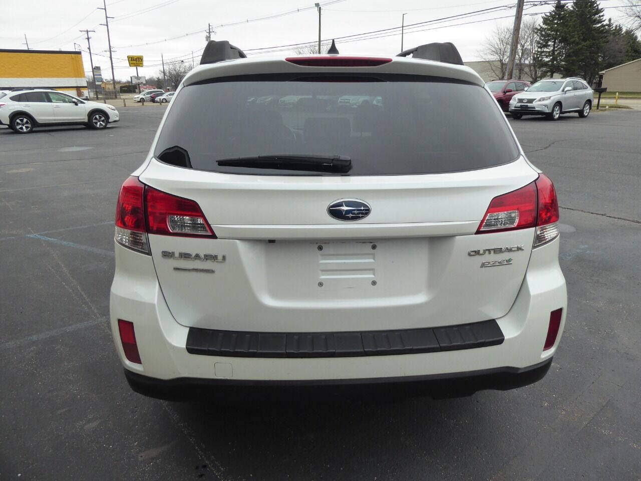 2011 Subaru Outback for sale at Lakeshore Autos in Holland, MI