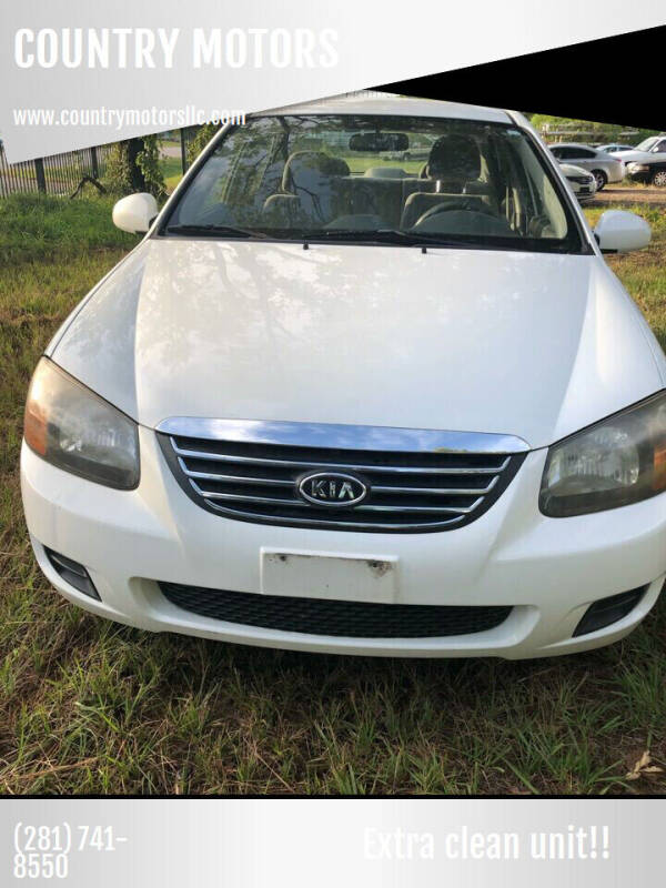 2009 Kia Spectra for sale at COUNTRY MOTORS in Houston TX