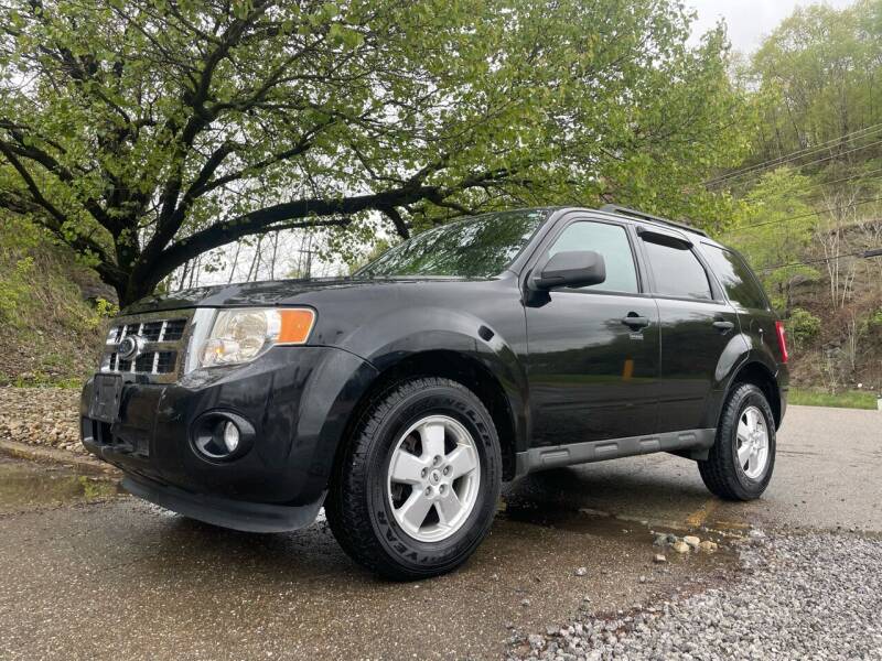 2011 Ford Escape for sale at Jim's Hometown Auto Sales LLC in Cambridge OH