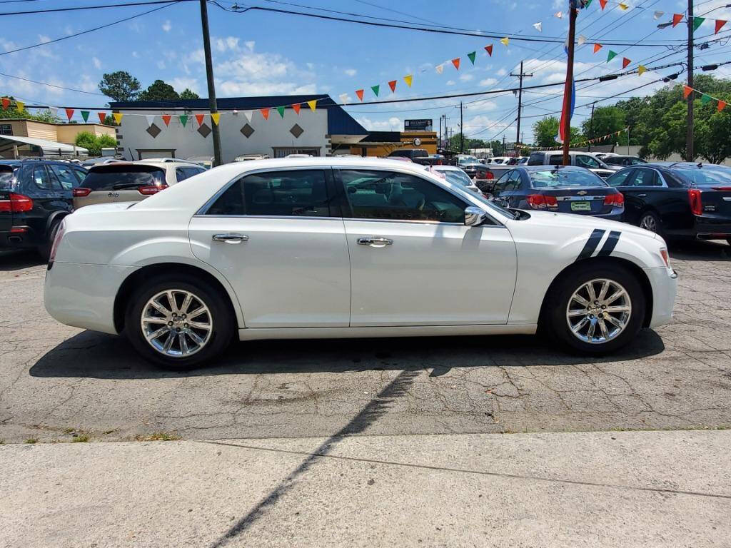 2014 Chrysler 300 for sale at DAGO'S AUTO SALES LLC in Dalton, GA