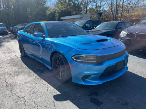 2015 Dodge Charger for sale at Magic Motors Inc. in Snellville GA