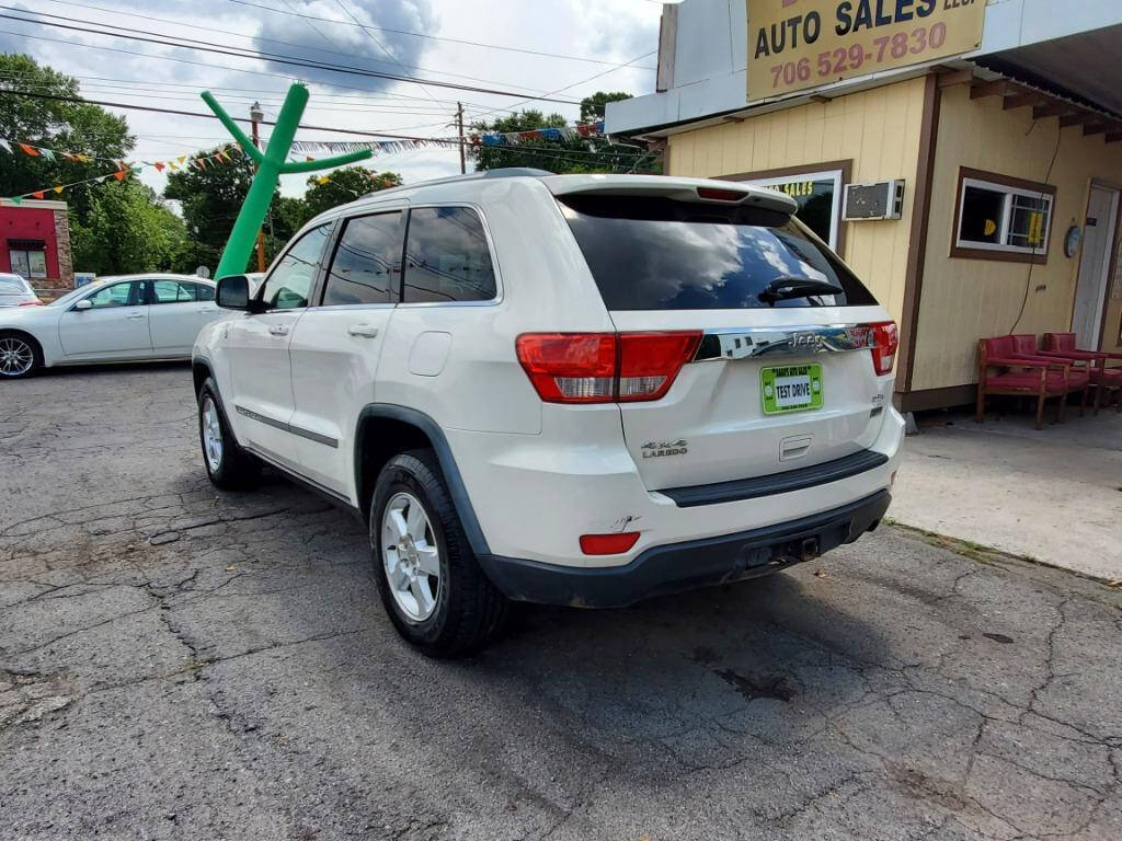 2011 Jeep Grand Cherokee for sale at DAGO'S AUTO SALES LLC in Dalton, GA