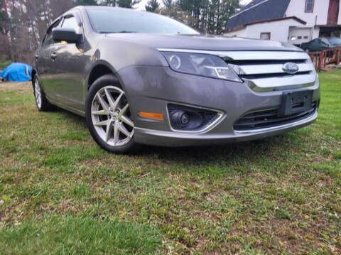 2010 Ford Fusion for sale at J & E AUTOMALL in Pelham NH
