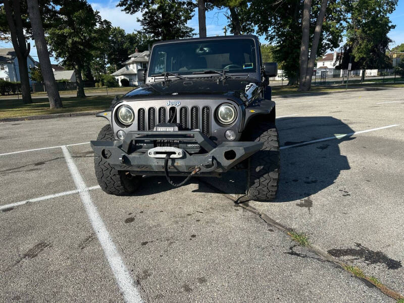 2016 Jeep Wrangler Unlimited for sale at Hicksville Auto Sales in Roosevelt NY