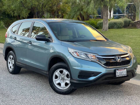 2015 Honda CR-V for sale at MILLENNIUM MOTORS in Van Nuys CA