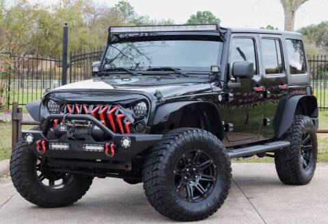 2013 Jeep Wrangler Unlimited for sale at Texas Auto Corporation in Houston TX