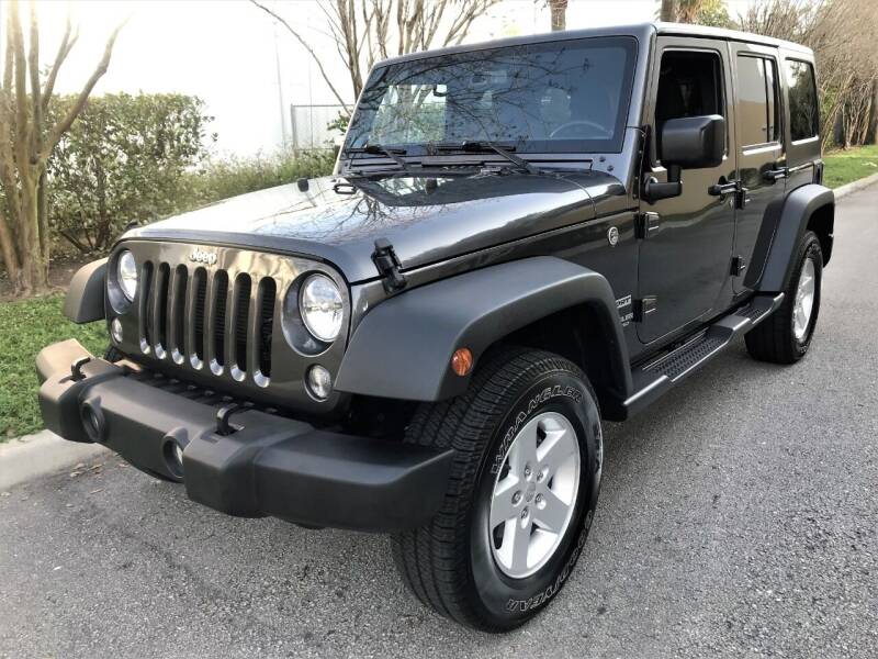 2017 Jeep Wrangler Unlimited for sale at DENMARK AUTO BROKERS in Riviera Beach FL