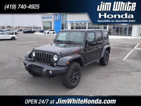 2016 Jeep Wrangler Unlimited for sale at The Credit Miracle Network Team at Jim White Honda in Maumee OH
