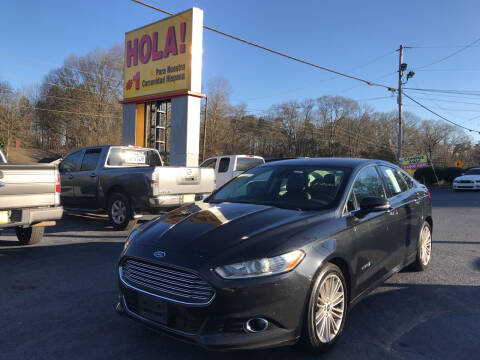 2013 Ford Fusion Hybrid for sale at NO FULL COVERAGE AUTO SALES LLC in Austell GA