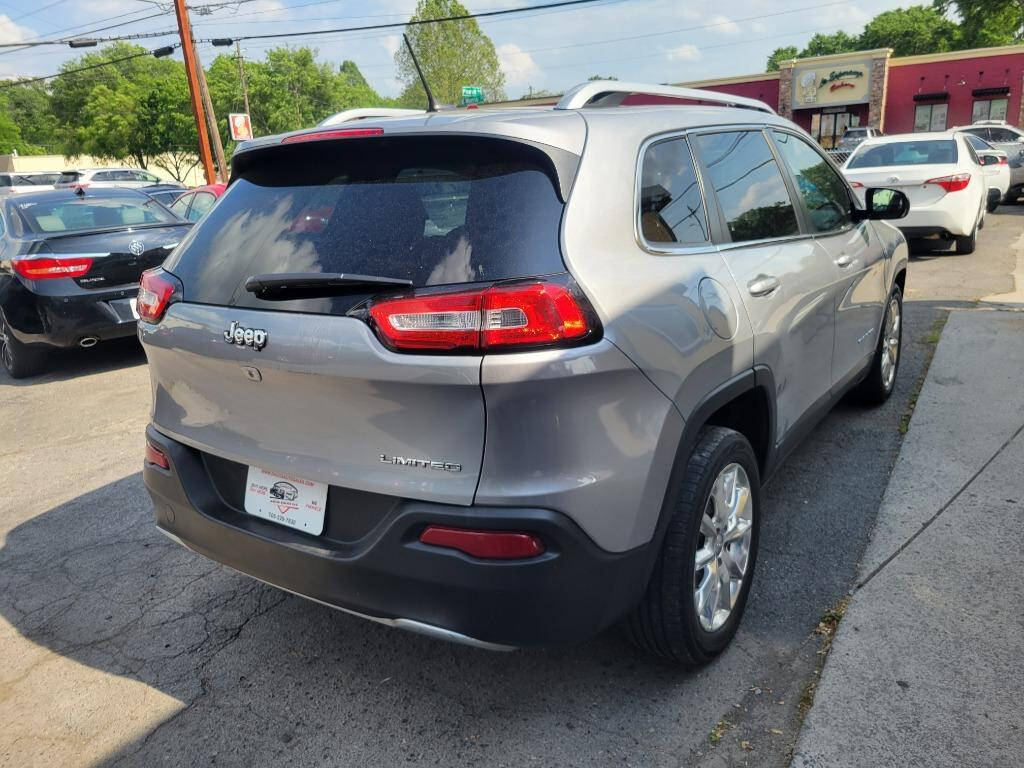 2014 Jeep Cherokee for sale at DAGO'S AUTO SALES LLC in Dalton, GA