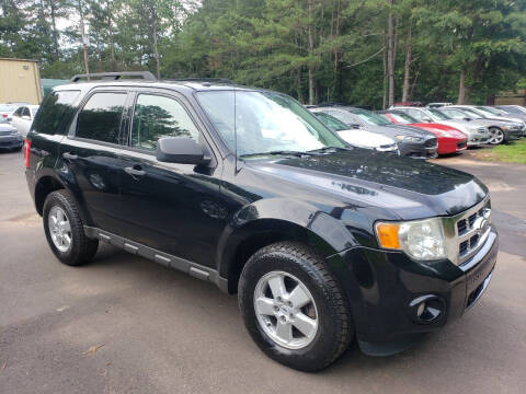 2009 Ford Escape for sale at GEORGIA AUTO DEALER LLC in Buford GA