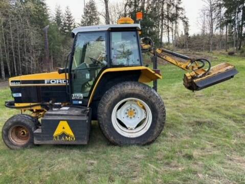 1995 Ford New Hollard 6640 Tractor Boom Flail Mower for sale at DirtWorx Equipment - Used Equipment in Woodland WA