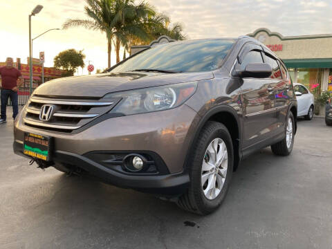 2014 Honda CR-V for sale at La Mesa Auto Sales in Huntington Park CA