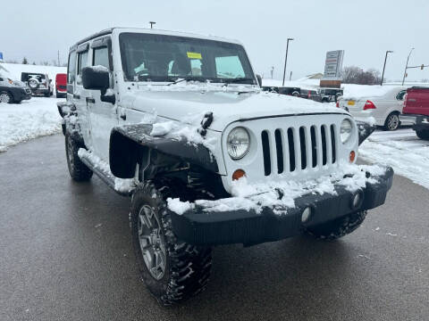 2013 Jeep Wrangler Unlimited for sale at Postal Pete in Galena IL