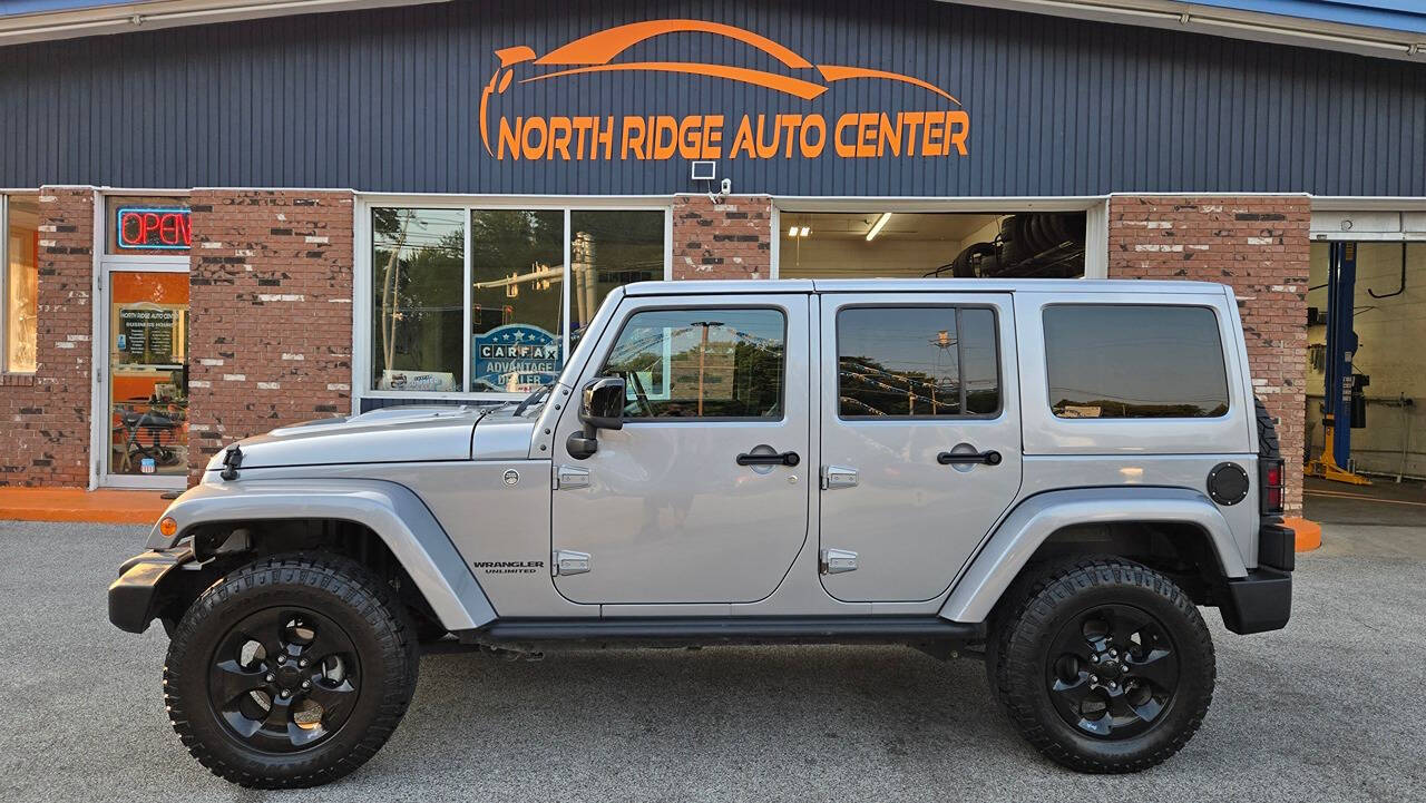 2015 Jeep Wrangler Unlimited for sale at North Ridge Auto Center LLC in Madison, OH