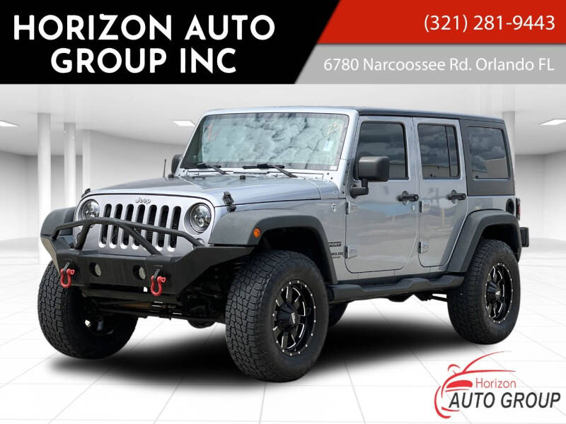 2014 Jeep Wrangler Unlimited for sale at HORIZON AUTO GROUP INC in Orlando FL