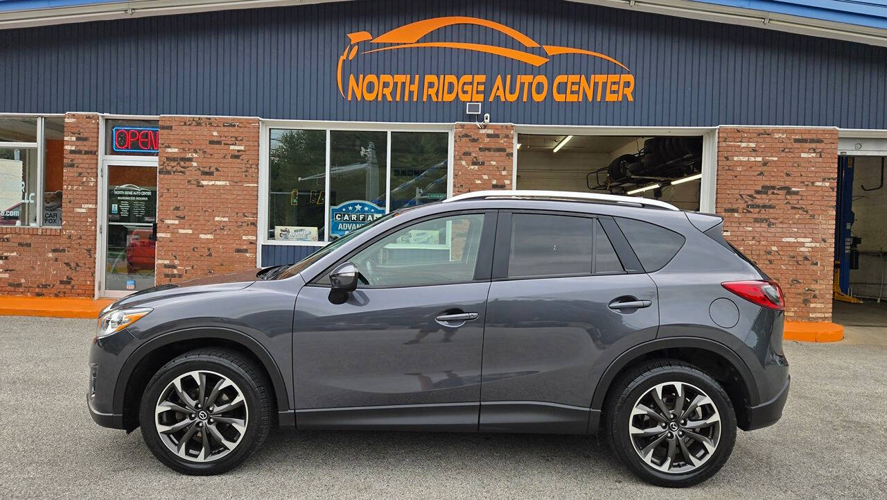 2016 Mazda CX-5 for sale at North Ridge Auto Center LLC in Madison, OH