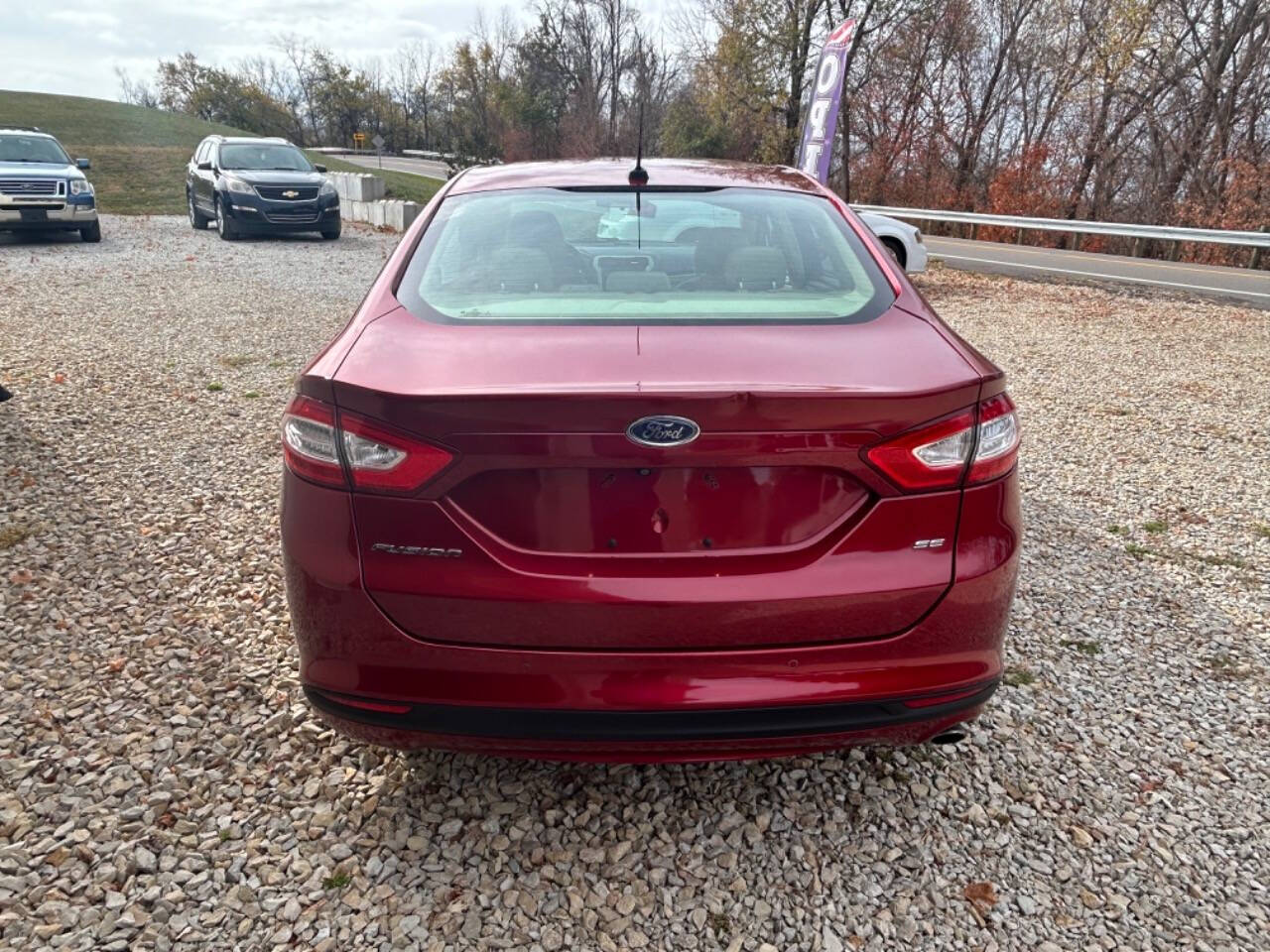 2014 Ford Fusion for sale at STRODES AUTO GROUP LLP in Malta, OH