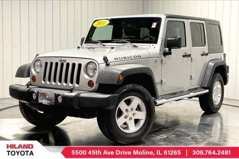 2011 Jeep Wrangler Unlimited for sale at HILAND TOYOTA in Moline IL