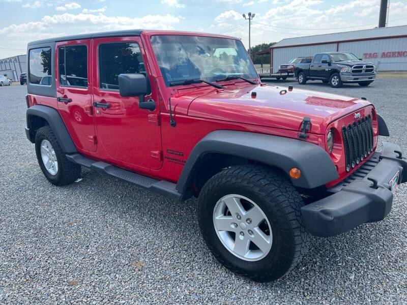 2014 Jeep Wrangler Unlimited for sale at RAYMOND TAYLOR AUTO SALES in Fort Gibson OK