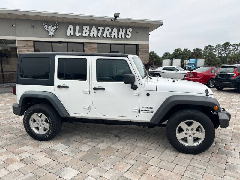 2013 Jeep Wrangler Unlimited for sale at Albatrans Car & Truck Sales in Jacksonville FL