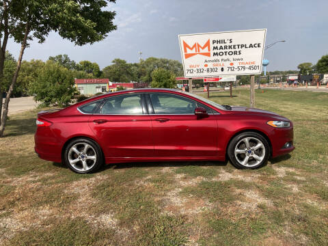 2014 Ford Fusion for sale at Phil's Marketplace Motors in Arnolds Park IA