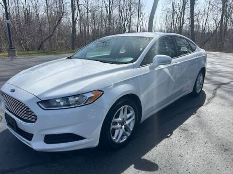 2015 Ford Fusion for sale at Lighthouse Auto Sales in Holland MI