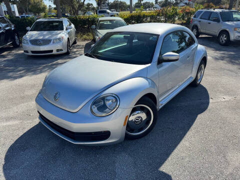 2012 Volkswagen Beetle for sale at REZAUTOS in Vero Beach FL