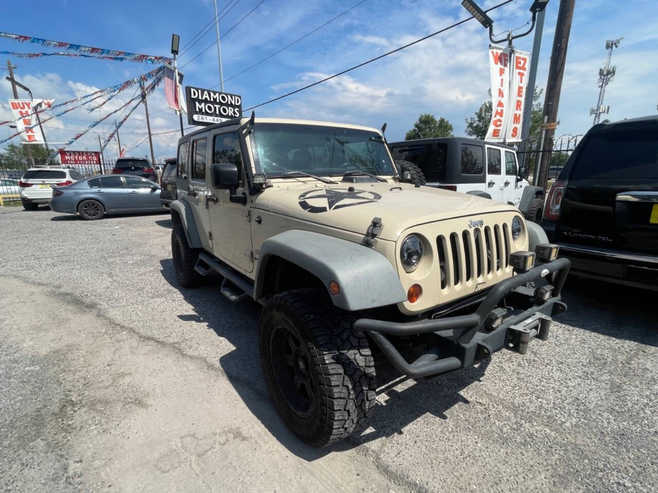 2011 Jeep Wrangler Unlimited for sale at DIAMOND MOTORS INC in Houston, TX