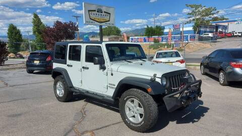 2014 Jeep Wrangler Unlimited for sale at CarSmart Auto Group in Murray UT