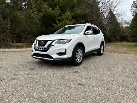 2019 Nissan Rogue for sale at Rombaugh's Auto Sales in Battle Creek MI