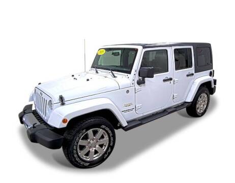 2015 Jeep Wrangler Unlimited for sale at Poage Chrysler Dodge Jeep Ram in Hannibal MO