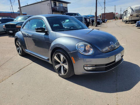2012 Volkswagen Beetle for sale at BERKENKOTTER MOTORS in Brighton CO