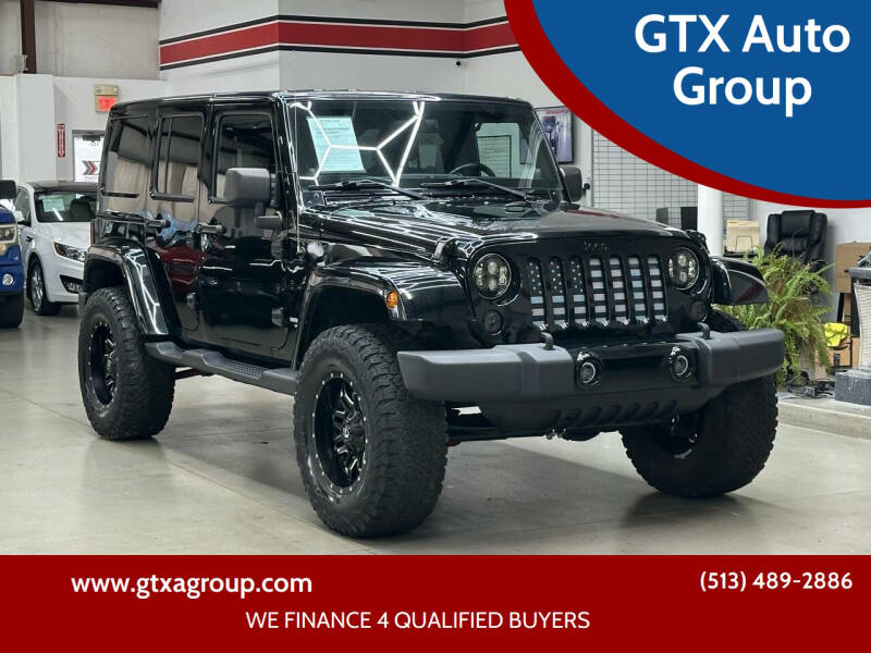 2012 Jeep Wrangler Unlimited for sale at GTX Auto Group in West Chester OH