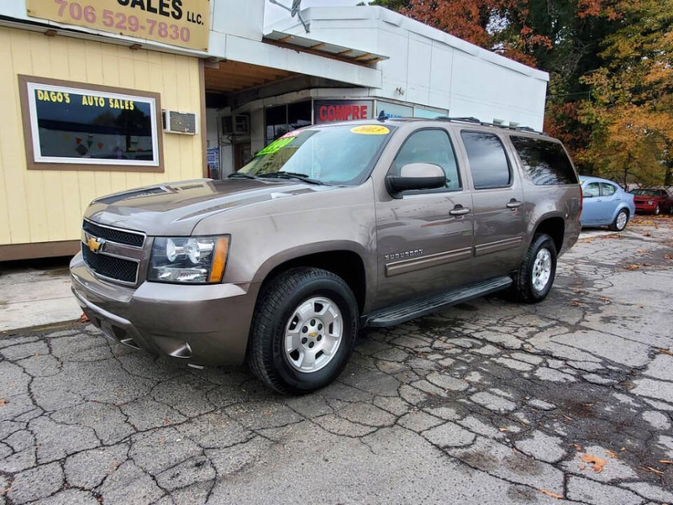 2013 Chevrolet Suburban for sale at DAGO'S AUTO SALES LLC in Dalton, GA