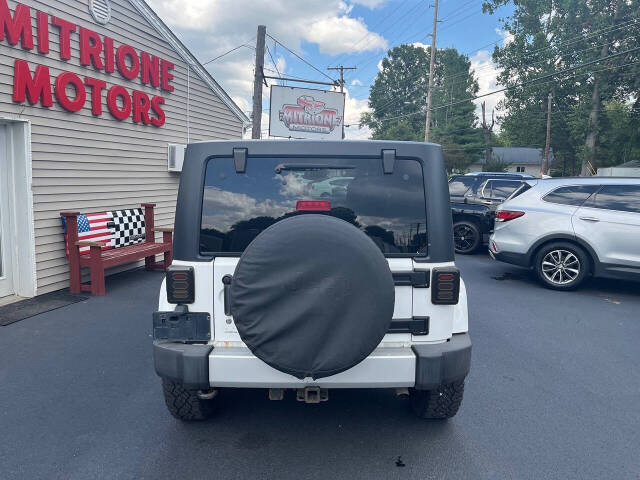 2013 Jeep Wrangler Unlimited for sale at Mitrione Motors in Springfield, IL