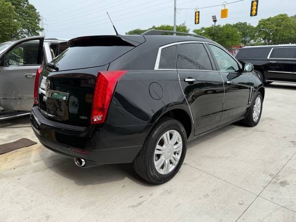 Used 2013 Cadillac SRX Base with VIN 3GYFNAE39DS639085 for sale in Detroit, MI