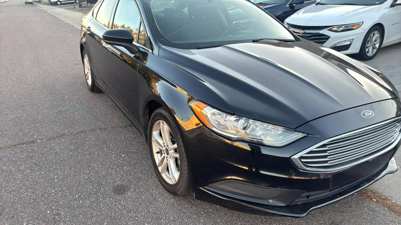 2018 Ford Fusion for sale at Ganda Auto Sales in Denver, CO