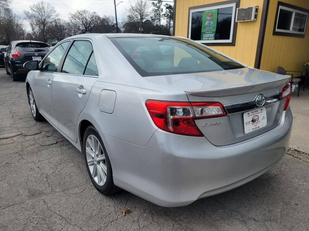 2012 Toyota Camry for sale at DAGO'S AUTO SALES LLC in Dalton, GA