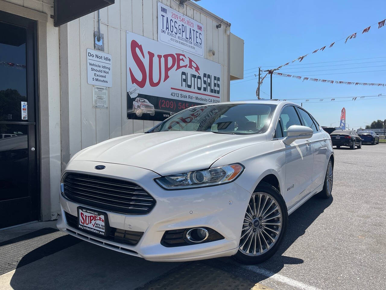 2014 Ford Fusion Hybrid for sale at Super Auto Sales Modesto in Modesto, CA