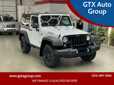 2014 Jeep Wrangler for sale at GTX Auto Group in West Chester OH