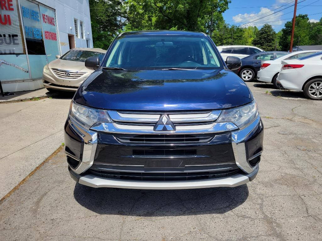 2016 Mitsubishi Outlander for sale at DAGO'S AUTO SALES LLC in Dalton, GA