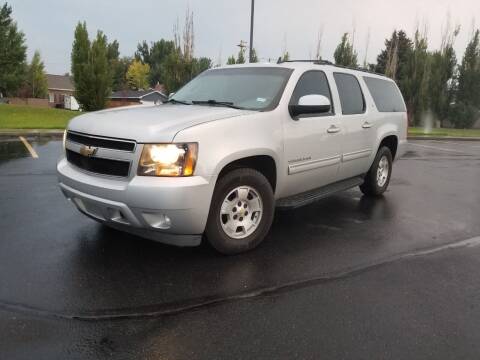 2011 Chevrolet Suburban for sale at KHAN'S AUTO LLC in Worland WY