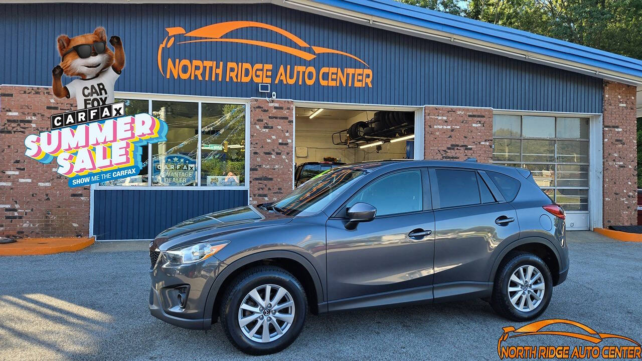 2015 Mazda CX-5 for sale at North Ridge Auto Center LLC in Madison, OH