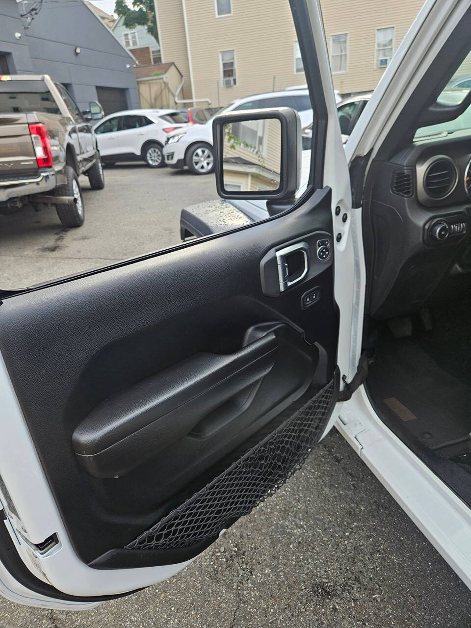 2020 Jeep Wrangler for sale at RENOS AUTO SALES LLC in Waterbury, CT