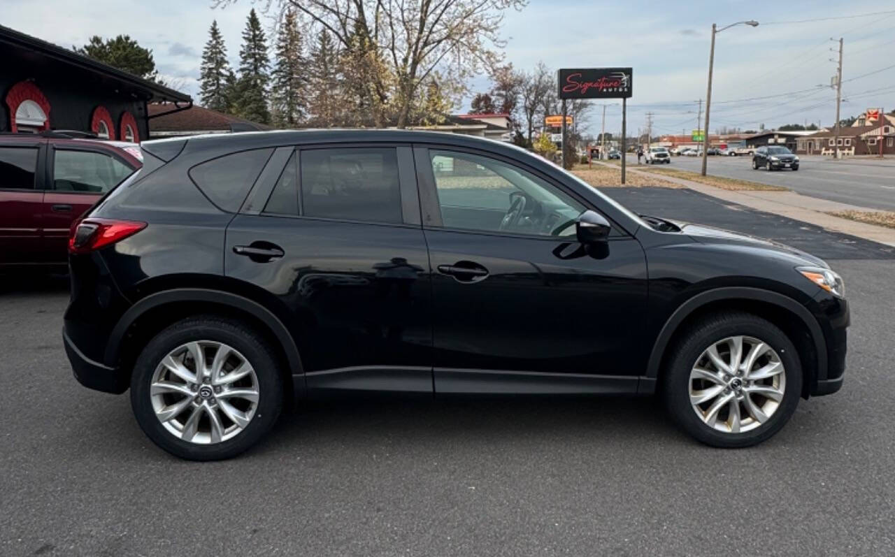 2015 Mazda CX-5 for sale at SIGNATURE AUTOS LLC in Weston, WI