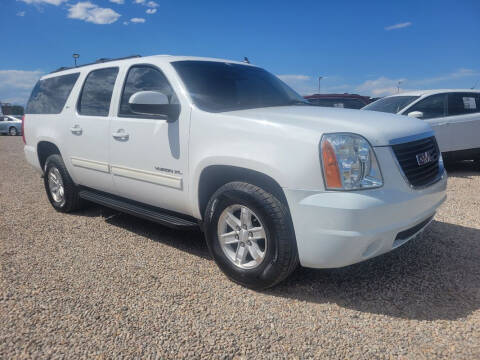 2013 GMC Yukon XL for sale at BERKENKOTTER MOTORS in Brighton CO