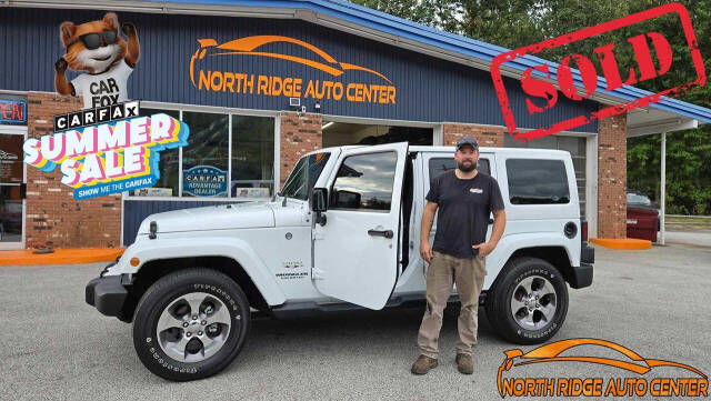 2016 Jeep Wrangler Unlimited for sale at North Ridge Auto Center LLC in Madison, OH