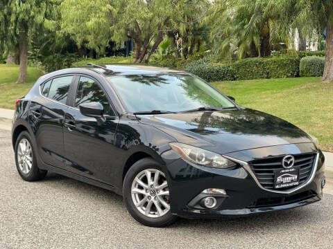 2014 Mazda MAZDA3 for sale at MILLENNIUM MOTORS in Van Nuys CA